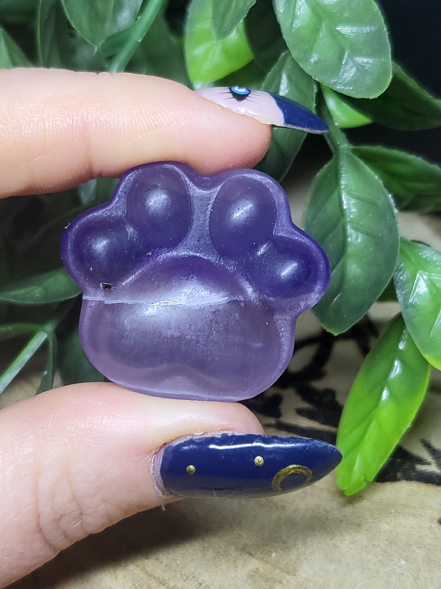 Purple fluorite paw print