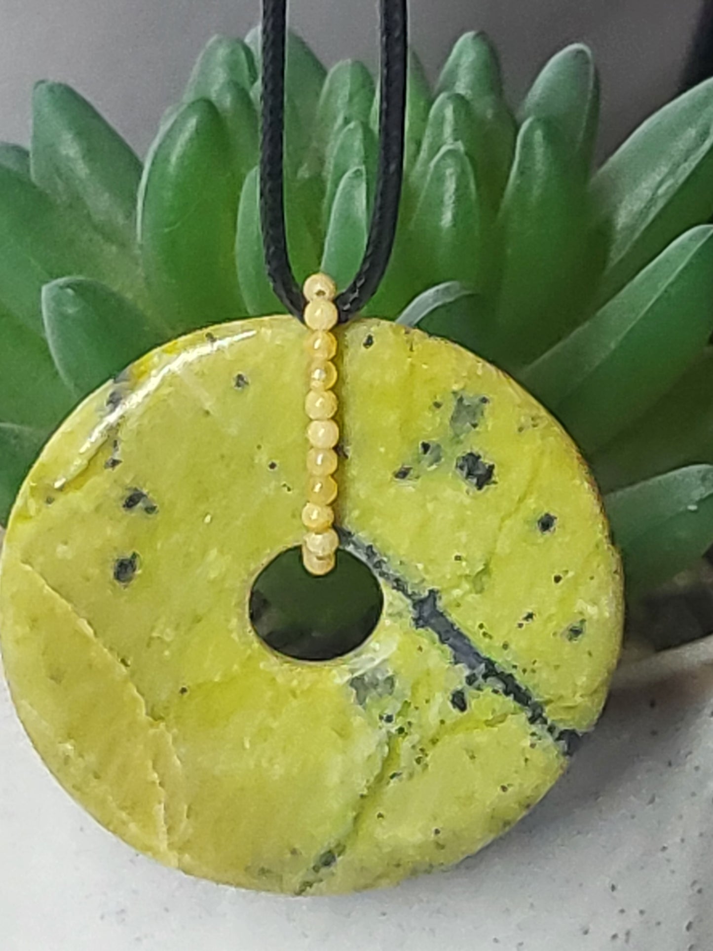 Serpentine donut pendant